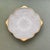A classic footed milk glass gilt edge decorative bowl in a textured vineyard pattern. Ships within 1-2 days using USPS....