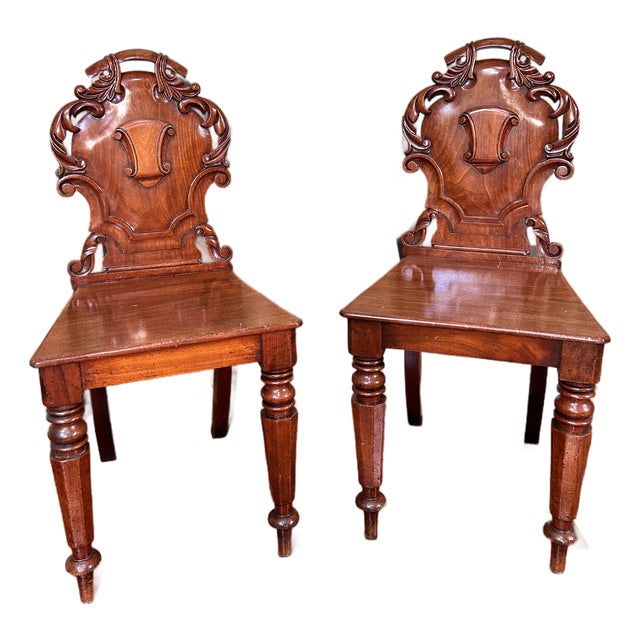 19th Century English Regency-Style Carved Mahogany Shield Back Hall Chairs - A Pair For Sale