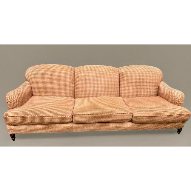 English style Chesterfield sofa, custom upholstered in a nubby rust red and tan checked fabric. Turned mahogany legs,...