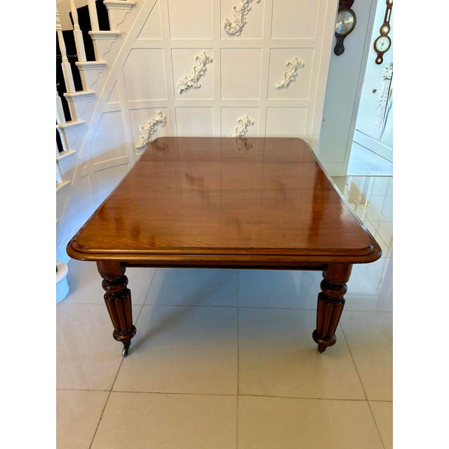 Antique Victorian quality mahogany 10/12 seater extending dining table having a quality mahogany top with a double moulded...