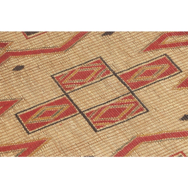 Made with handwoven reed and camel leather in Mauritania circa 1950-1960, this 4x4 vintage square Tuareg mat is an...
