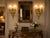 A magnificent pair of 19th-century French Louis XVI-style wall sconces, crafted from solid bronze with a beautifully aged...