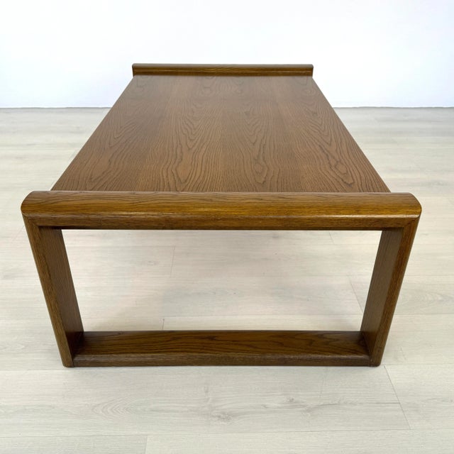Dimensions: H 18” x W 57.5” x D 32” Vintage large Brutalist rectangular oak sleigh coffee or side table attr. to Gunlocke...