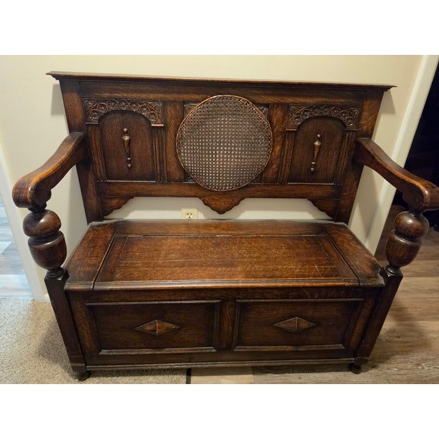 Antique Oak Hall Bench Features Intricate Carvings and a Circular Cane Insert in the Backrest, Late 19th Century For Sale - Image 4 of 9