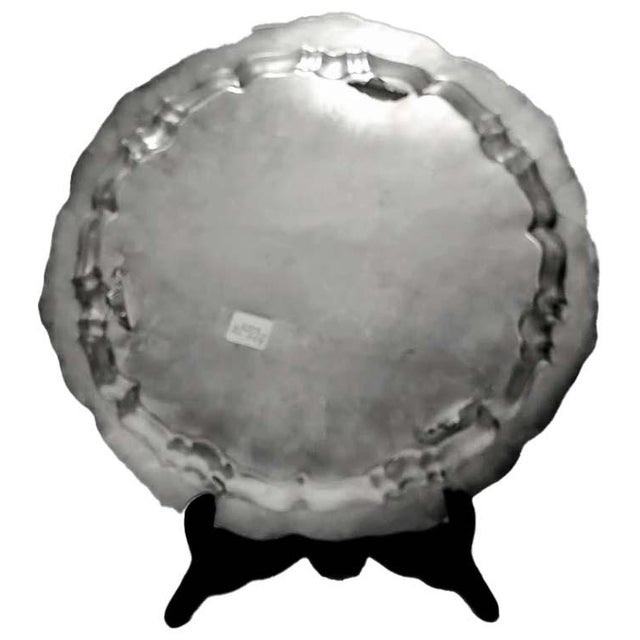 This is a vintage Old English by Poole silverplate round footed platter with an ornate scrolled edge and etched...
