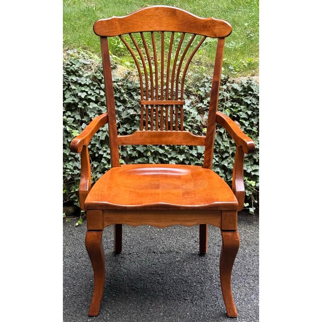 Beautiful set of six Nichols & Stone dining chairs, featuring classic fan-back styling and a warm, rich wood finish. The...
