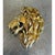 This vintage lion's head brooch is a striking, dimensional statement piece cast in warm gold-tone metal, capturing the...