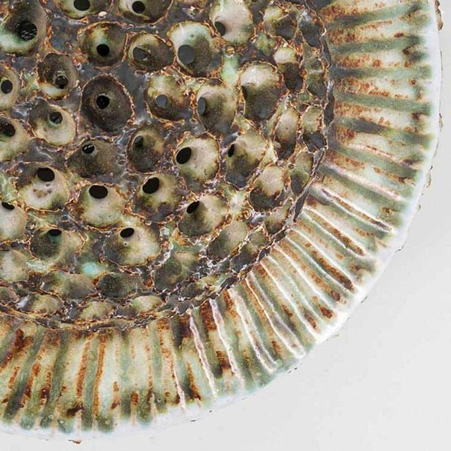 Spectacular circular ceramic wall light, with beautiful accents. Manufactured in denmark in the 1970s. In excellent...