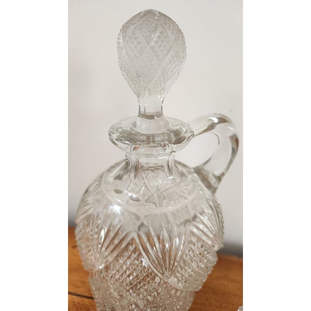 Elevate your collection or home decor with this stunning trio of antique cut glass decanters, crafted in the style of the...