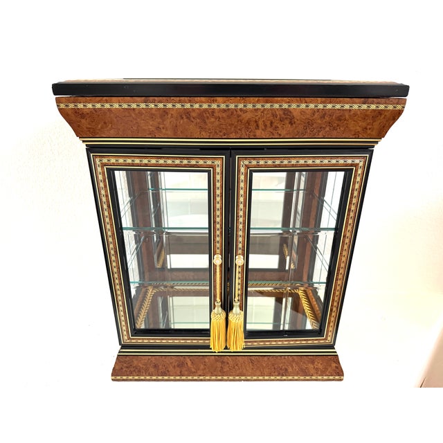 Beauty of burl wood, mirror top, marquetry design, glass and beveled mirrors reflects on this super attractive Curio/...