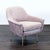 This lounge chair by West Elm features a soft pink fabric and stylish brass legs. The seat and back are cushioned for...