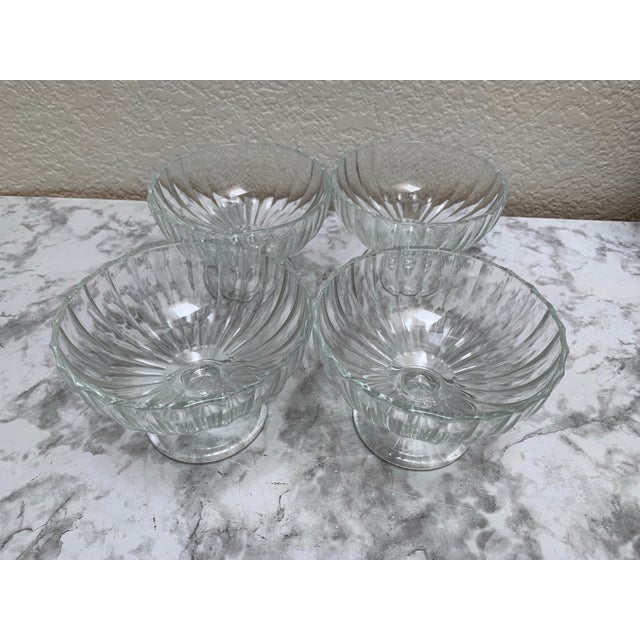 Vintage set of four scalloped glass pedestal bowls with pedestal base. Perfect for dessert, fruit or berries. Set of four.