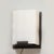 This elegant Pair of Modernist Alabaster & Oil-Rubbed Bronze Wall Sconces originated in the United States, 20th Century....