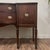 Vintage mahogany bow-front buffet with Georgian-style detailing, featuring reeded tapered legs, oval brass-toned pulls...