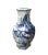 This is a Chinese decorative porcelain vase in Blue and White color finish. The theme is oriental mountain tree scenery...