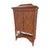 A tall rattan cabinet defined by its angular lines and subtle pagoda-style top. The front features diamond-weave doors...