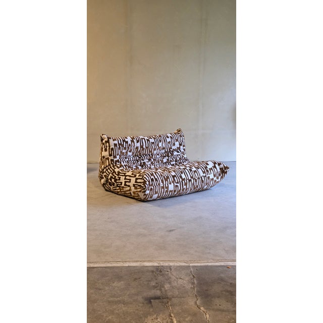 2 seater Togo sofa by Lige Roset, original tag on the sofa. Reupholsterd in Rizaro Havana fabric. Undercloth also renewd....