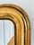 An antique French Louis Philippe mirror, dating to the late 19th century. This mirror has a giltwood frame with a warm...