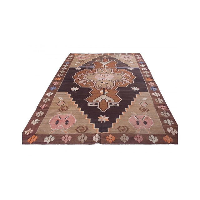 Vintage handwoven decorative kilim rug from Kars region of Turkey. Approximately 50-60 years old. In very good condition.