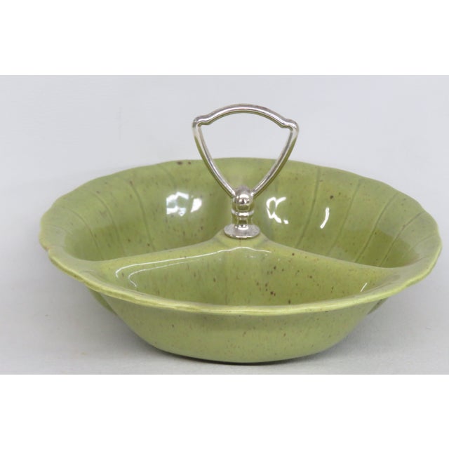 This lovely Serving Bowl is made of ceramic and metal. This divided bowl has excellent Mid Century vintage design; it...