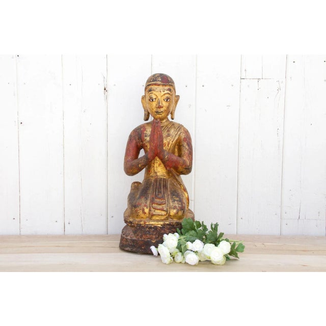 This beautiful Burmese monk statue with a serene and calm expression has a gorgeous patina and gilded worn finish. It is...
