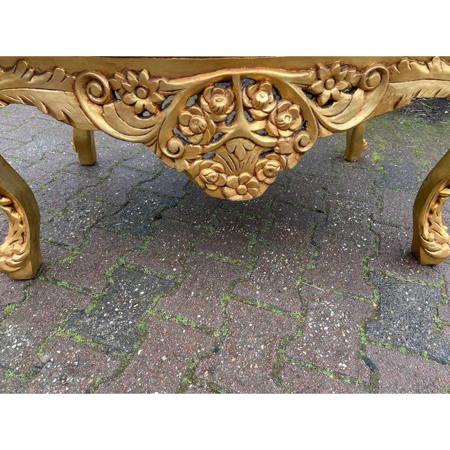 A refined 1940s Italian Baroque Rococo–style coffee table, handcrafted in solid beechwood with an original Italian marble...
