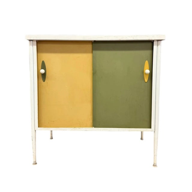 This vintage mid-century modern record cabinet credenza, reminiscent of George Nelson’s iconic style, exudes a timeless...