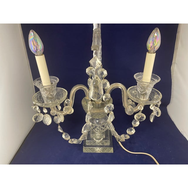 Up for sale a pair of vintage Regency style electrified heavy cut crystal candelabrum circa 1930s - 1950s. The candelabrum...
