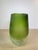 Striking handblown glass vase in a rich olive-to-emerald green ombre, transitioning from a smooth glossy rim down through...