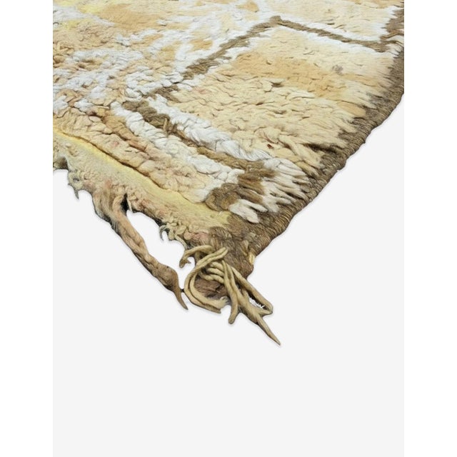Vintage Beige and Yellow Moroccan Rug – Handmade Berber Wool Rug This beautiful vintage Moroccan rug features a warm beige...