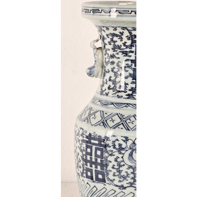 A vintage classic blue and white double happiness vase.