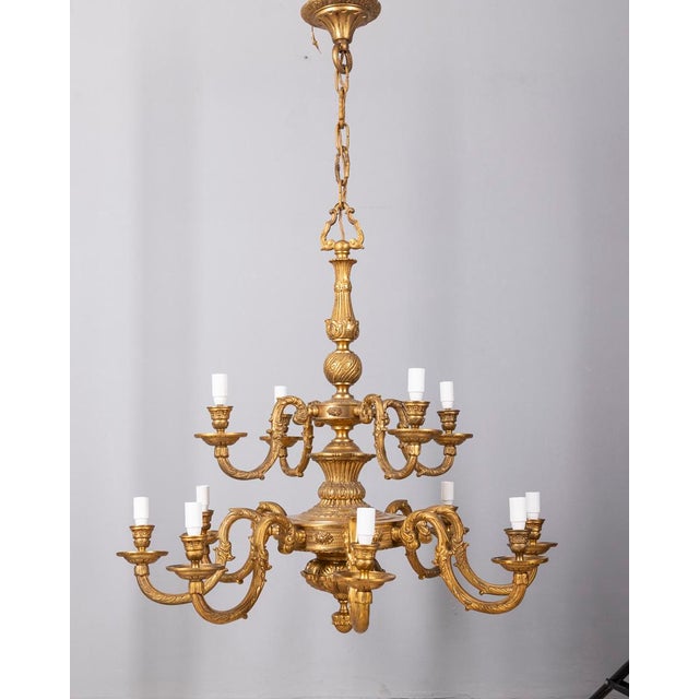 Chandelier with a structure in gilded and decorated cast bronze, two tiers with 12 lights, Classic style, made in Italy in...