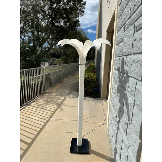 This elegant and eye-catching vintage floor lamp is designed in the glamorous Hollywood Regency style, often attributed to...