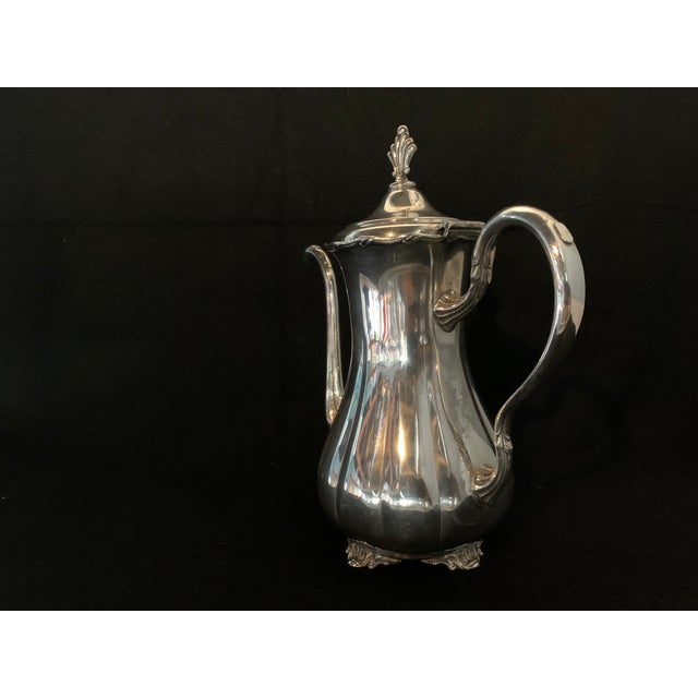 A gorgeous, matching two-piece vintage silver-plated beverage service set from Wm. A. Rogers (Canada). Both pieces feature...