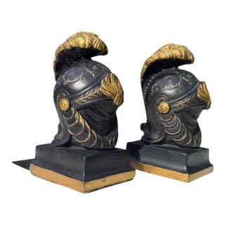 Vintage Neoclassical Greek Corinthian Helmet Bookends in Black & Gilt Finish, a Pair For Sale