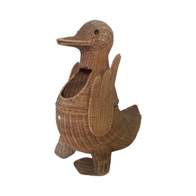 Ca. 1970’s small laundry basket or magazine holder by Olivier Cajan. Made from ratan / wicker and in good condition with...