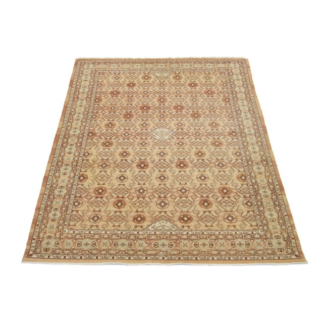 This beautifully crafted oriental rug, featuring a symmetrical central medallion and intricate floral and geometric motifs...