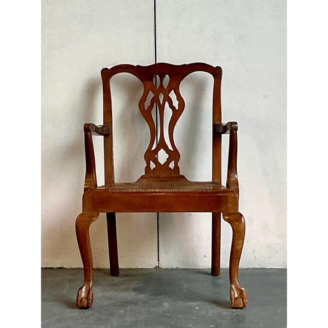 Discover the timeless elegance of this Vintage Regency Fireside Chair by Paine Furniture, a distinguished piece that...