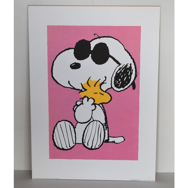 This Peanuts poster features Snoopy in his legendary Joe Cool persona—complete with iconic sunglasses—giving Woodstock a...