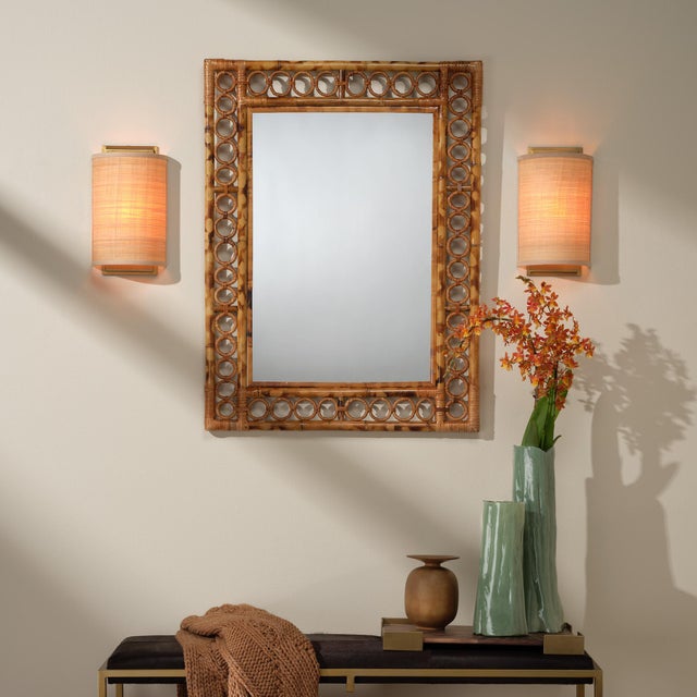 Brighten small spaces or lighten a dim hallway with this lovely artisan-crafted wall sconce. Natural raffia softens and...