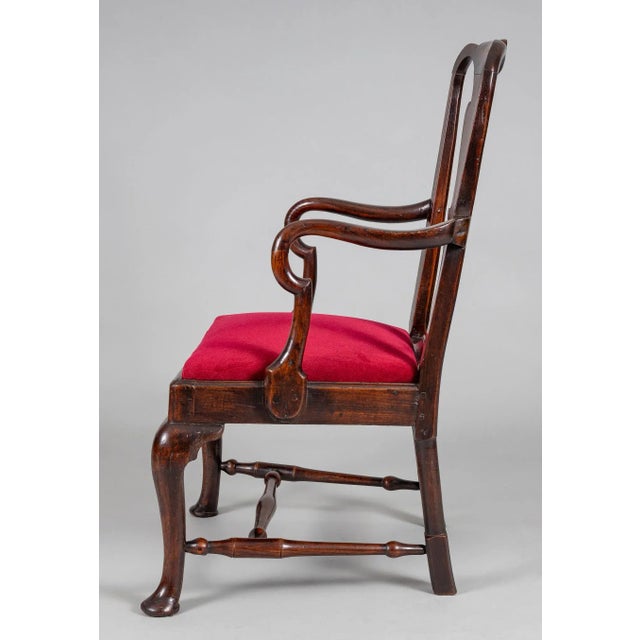 George II boldly figured elm open armchair with vase shaped splat, shepherds crook arms, cabriole legs ending in pad feet,...