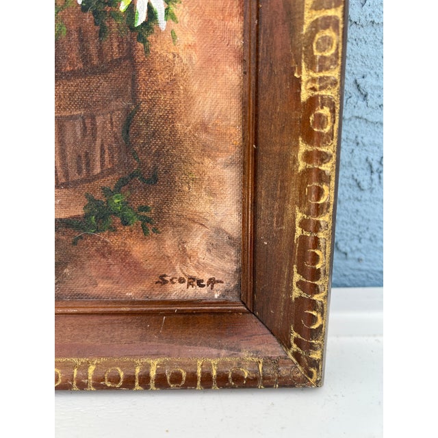 Mid 20th Century Painting of a bouquet of white daisies arranged in a wooden bucket. Hand carved wood frame. Signed on the...