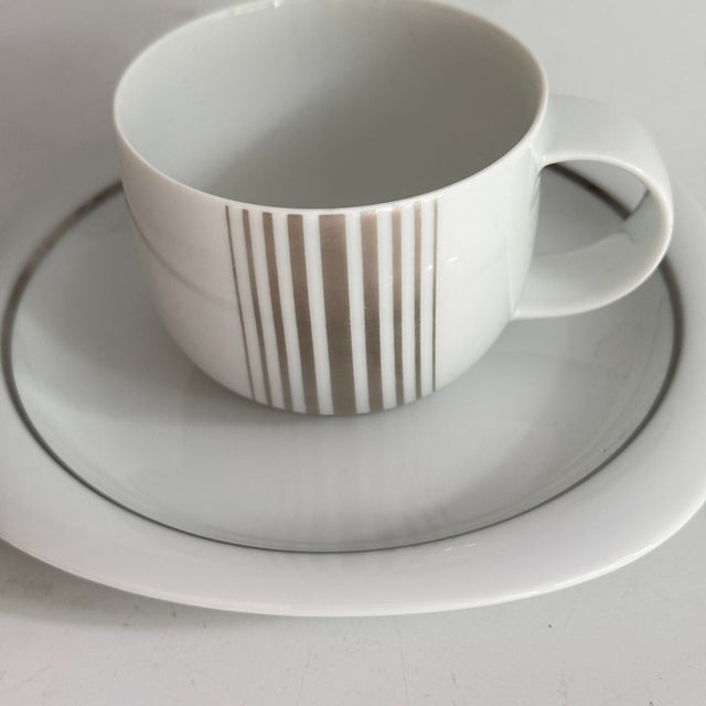 Coffee cup and saucer set Series: Suomi Decoration: Linja Material: Porcelain Design: Timo Sarpaneva Cups from 1979,...