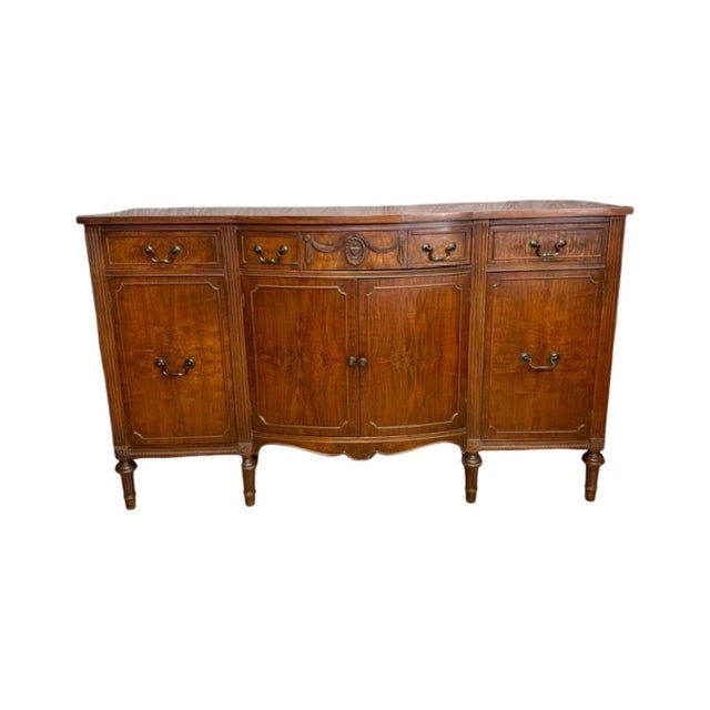 Vintage c.1950's Drexel Serpentine Breakfront Buffet Credenza. Crafted from solid wood and premium mahogany veneers, the...
