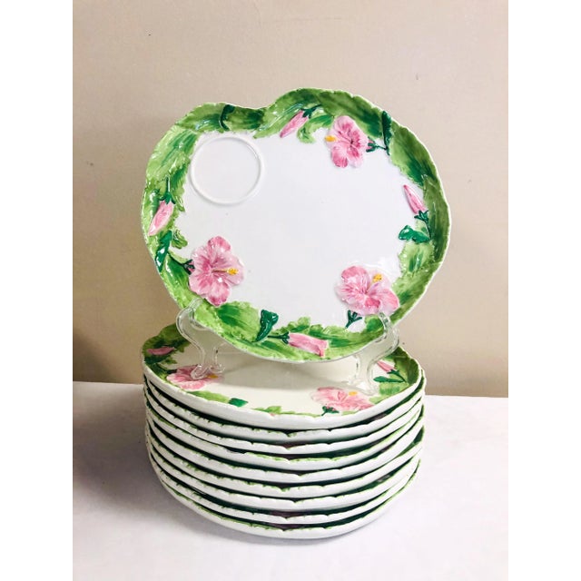 Set of ten Italian luncheon plates with painted hibiscus circling the rim. They are marked.