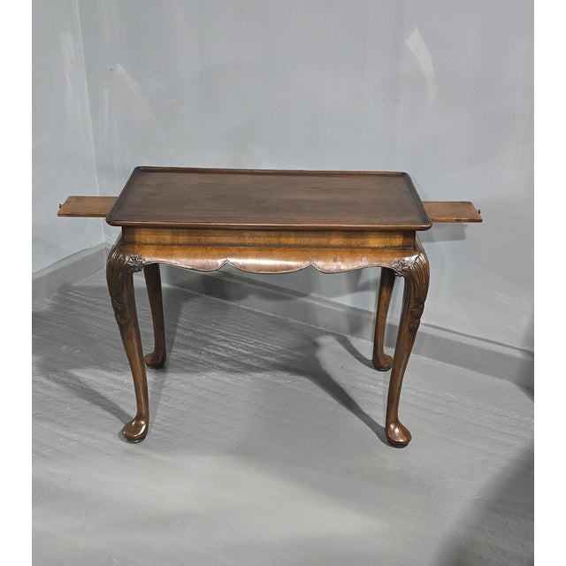 A very nice quality Queen Anne walnut tray topped with an occasional coffee table two slides, outswept apron and standing...
