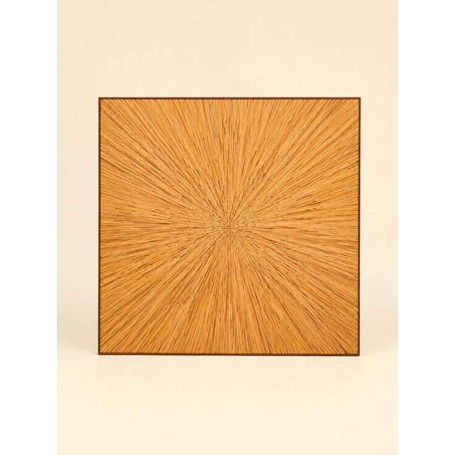 Square coffee table in straw marquetry with radiating decoration, glass top (minor damage).