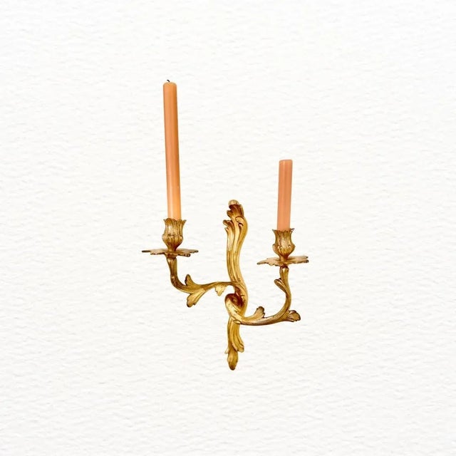 These 2-arm sconces are ornate and very beautiful in person. It’s hard to get a decent photograph of them but they look...