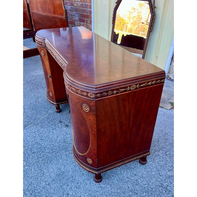 Beautiful and high quality depression era vanity dresser with hanging mirror by Romweber. Figured mahogany with carved...
