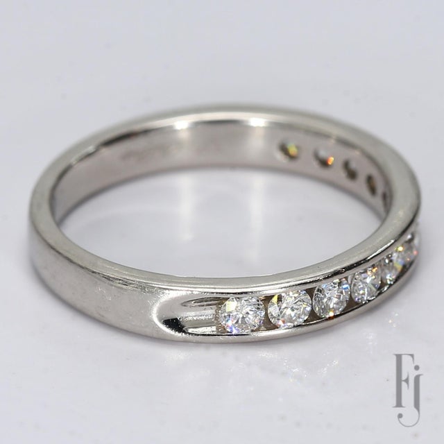This is a platinum & Channel Set Diamond Ring with Twelve ~0.06ct, 2.5mm diamonds graded at VS2/F. Ring Size - 5.75 Total...